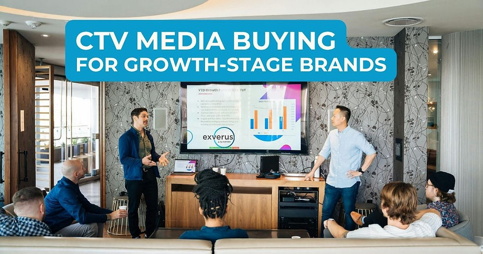Team meeting in a modern lounge as two men present CTV MEDIA BUYING FOR GROWTH-STAGE BRANDS on a screen.