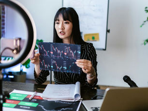 woman holding up graph to camera