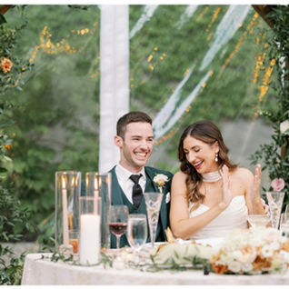 cheering bride and groom at head table