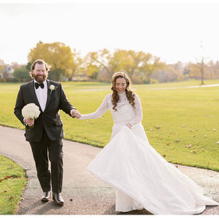 bride and groom walking on a trail