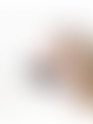 bride and groom smiling face to face under bridal veil