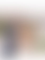 bride and groom embracing along riverfront