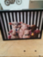 Sheep family wearing glasses, bow ties, and hats, on black and white stripes.