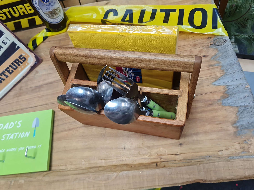Thumbnail: Wooden utensil holder with spoons, forks, and caution tape in background.