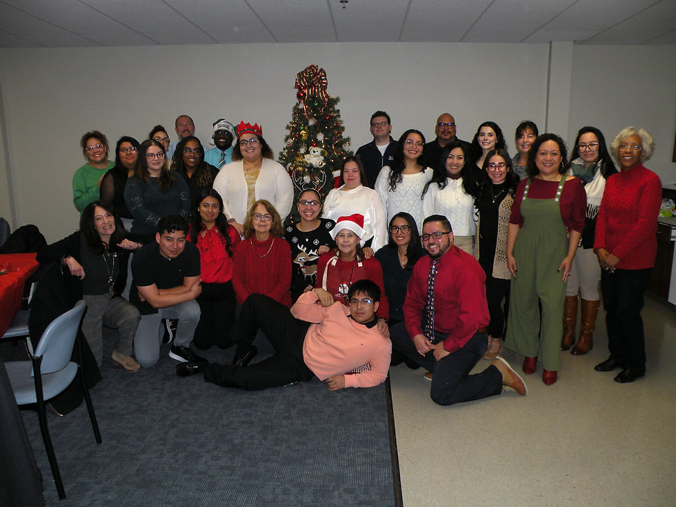 Group photo of Bay Atlantic FCU staff in front of Christmas tree.