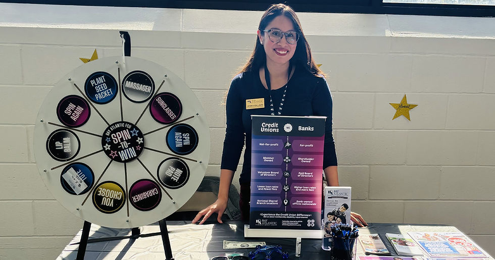 Employee Mari standing at BAFCU promotional booth