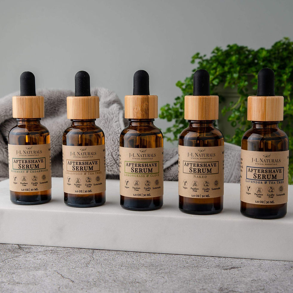 Five essential oil bottles, each labeled 'Rejuvenating Serum', with wooden tops.