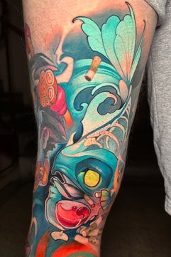 Colorful new school style fish and wave tattoos.