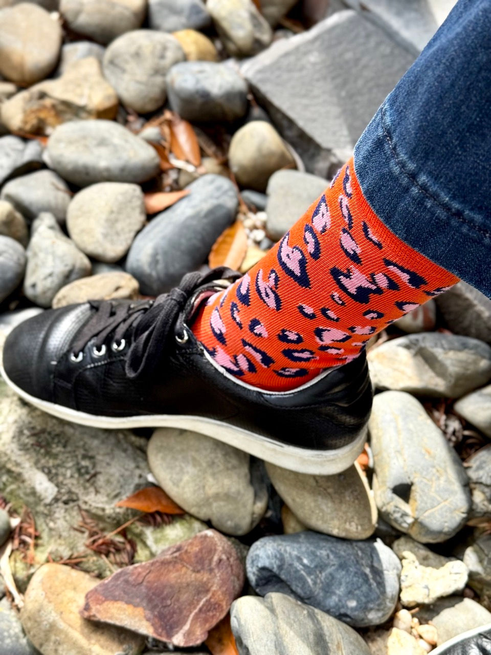 Jungle Jam orange animal print socks design by Loopla