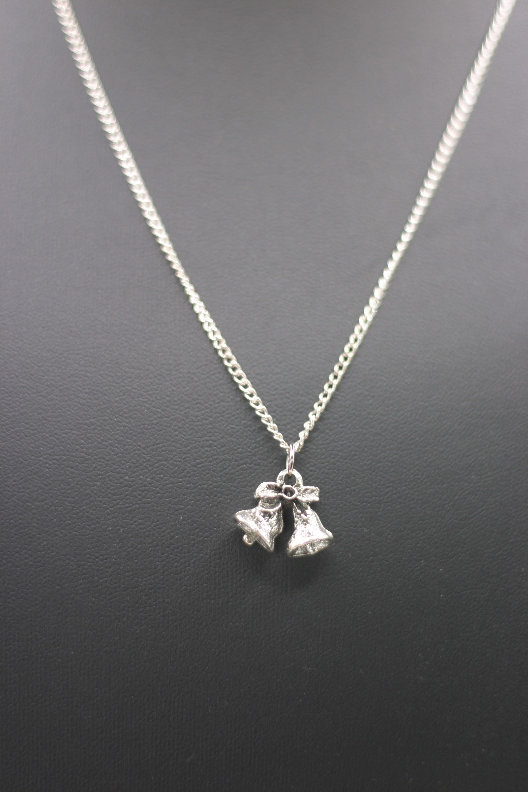 Necklace with mini bells pendant