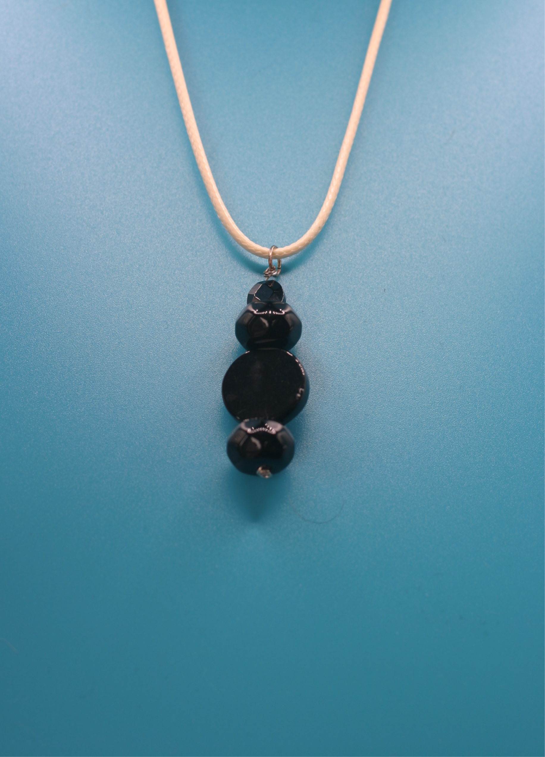 Necklace with black beads pendant