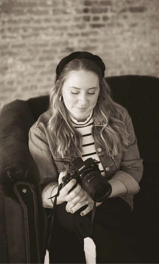 women smiling down at camera
