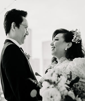 Intimate black-and-white moment of couple captured during all-inclusive wedding day.