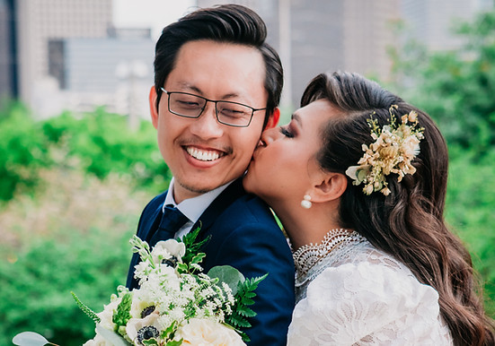 Bride and groom embracing outdoors with joyful smiles planned by Houston's number one all-inclusive wedding planners.