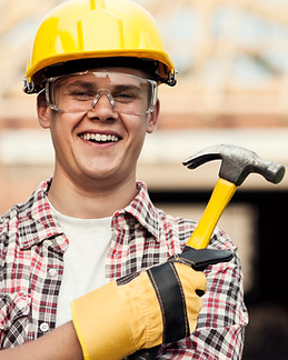 Construction-worker-with-hammer-iStock_000020830881_Medium.jpg