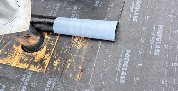 Professional roofing crew working on residential roof