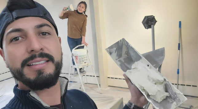 Husband and wife owners of Mile High Remodeling smiling together, representing family-owned values