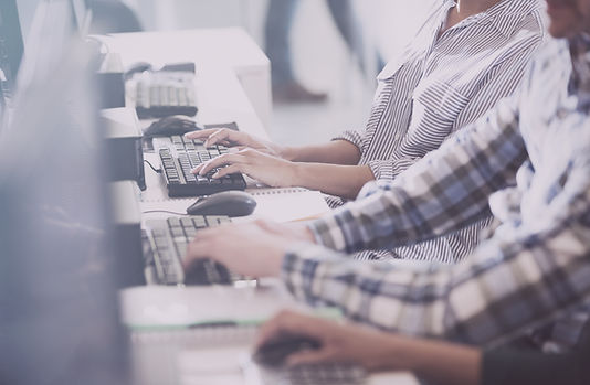 Computer users in an office setting.