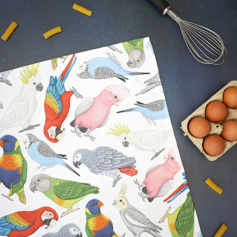 Thumbnail: A white tea towel made from organic cotton with printed illustrations of parrots all over it.