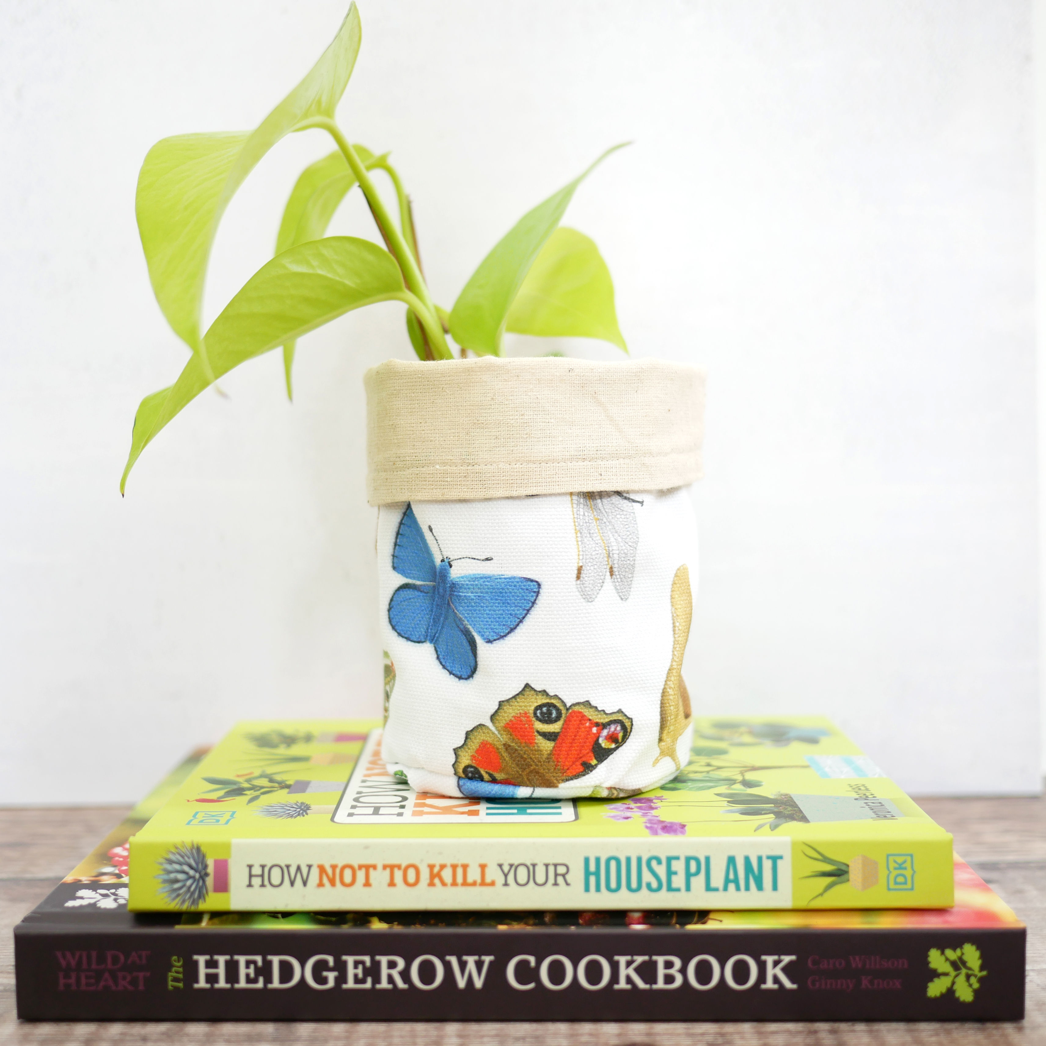 Small handmade fabric planter with illustrations of british invertebrates