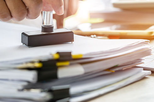 business-person-s-hand-stamping-approved-application-form-notary-public-stamping-documents