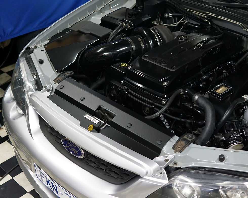 Thumbnail: A close up of a Ford Falcon BA/BF engine bay with an Aerocutt aluminium replacment air diversion plate/cooling panel in powde