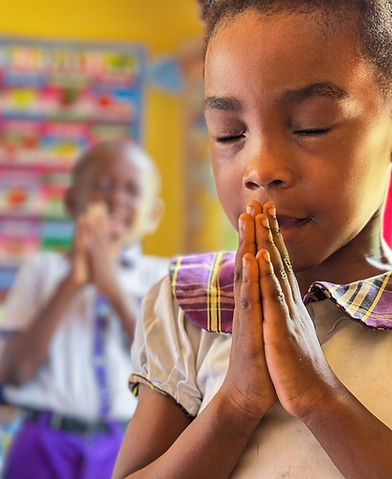 A beautiful girl from Great Montessori praying to her creator