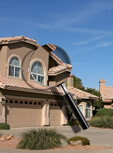 Home image with magnifying glass representing a complimentary pre listing home inspection
