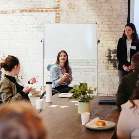 Mackenzie Langley, Founder & CEO of Lighthouse speaking with a group of people