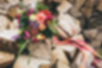 My DIY wedding flowers sitting ontop of a rustic wood pile and the royal forester
