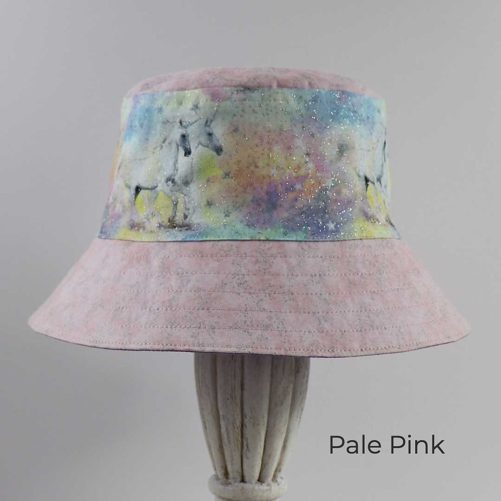 Thumbnail: Pale, pastel pink bucket hat featuring ethereal, white unicorns.