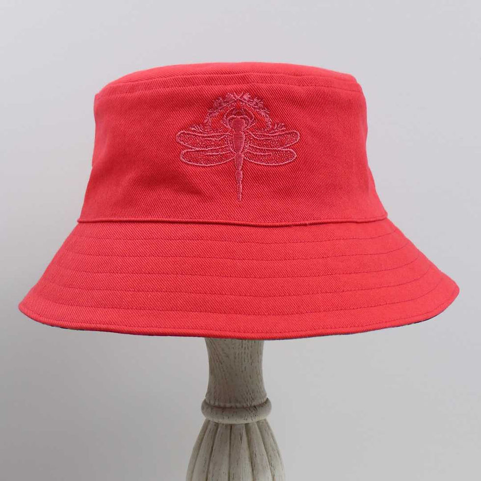 Thumbnail: Reversible bucket hat in bright salmon. The dragonfly logo is embroidered on the front.