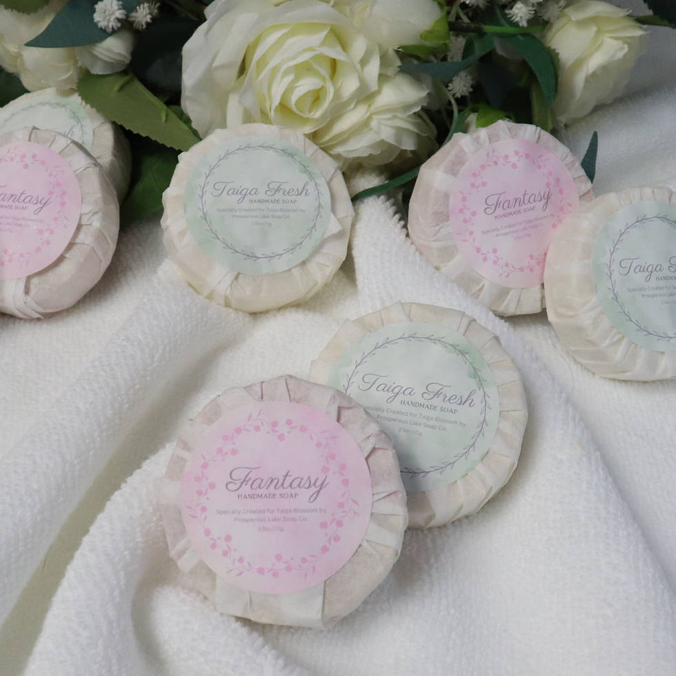 Thumbnail: Luxury, hand crafted soaps in Fantasy and Taiga Fresh fragrance. Wrapped in white or paper with a pink label or green label.