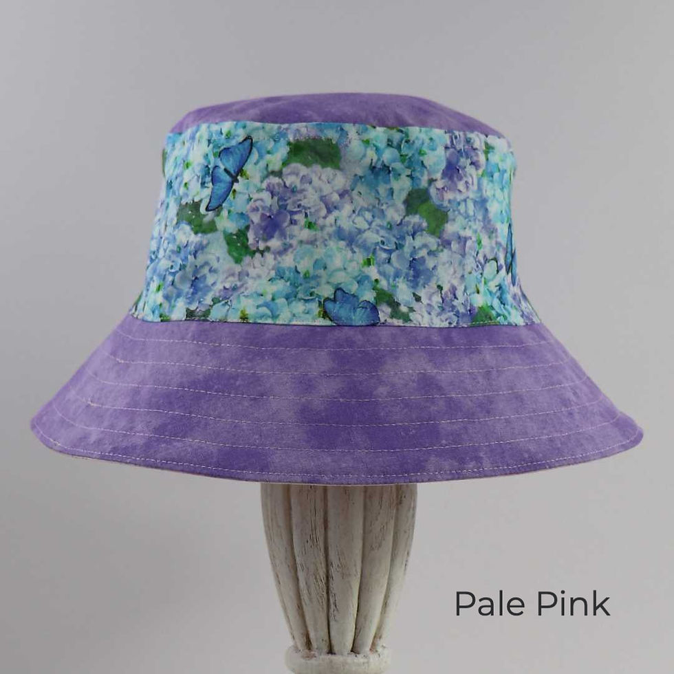 Thumbnail: Reversible bucket hat with mid-purple brim and top and a blue and purple, floral band.