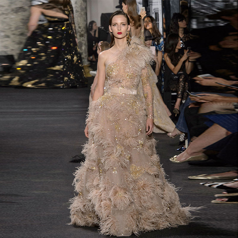 Thumbnail: Elie Saab One Shoulder Long Sleeves Gold Crystal Feather  dresses