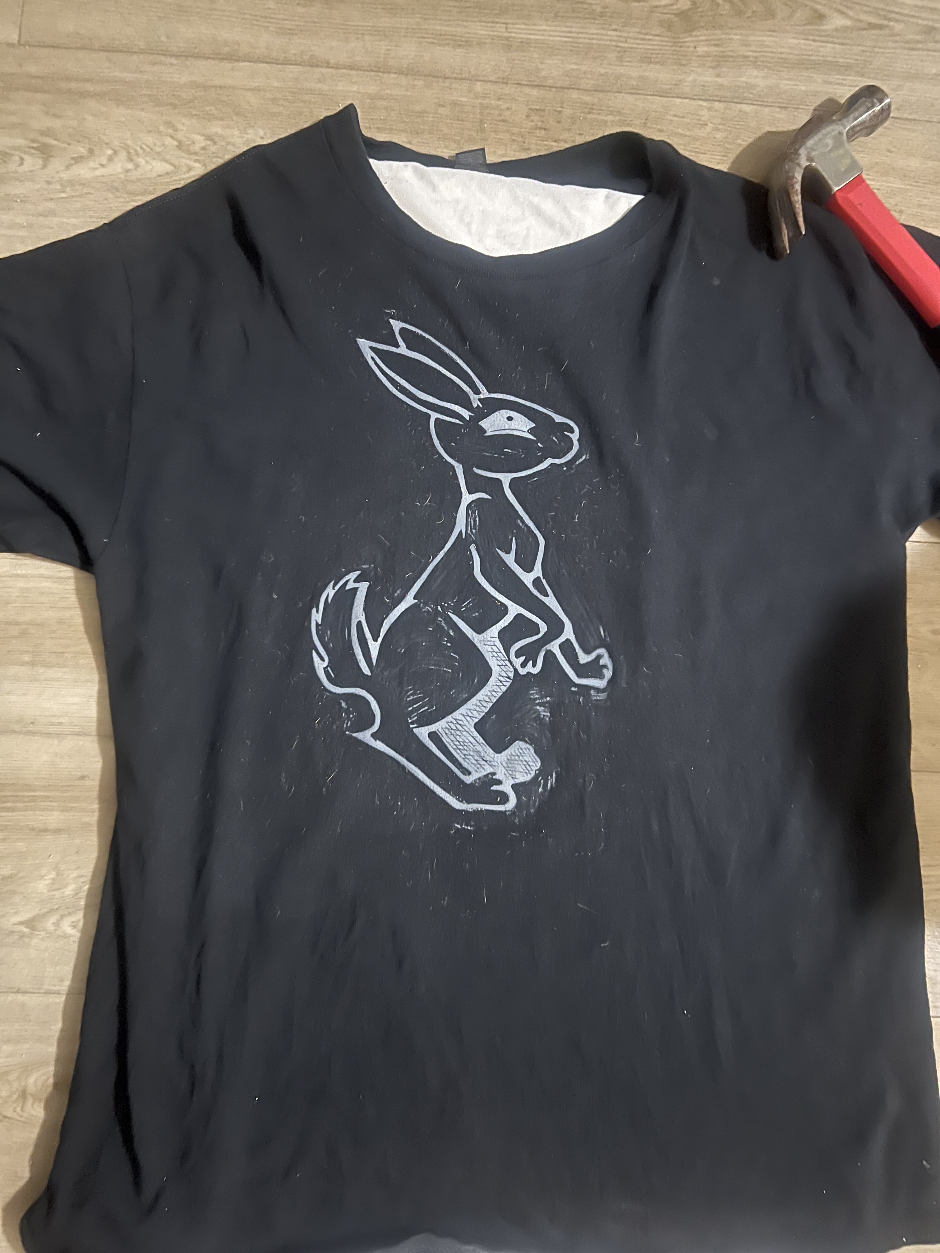 Cartoon bunny (Bunny81 Logo) printed in white ink on a black t-shirt