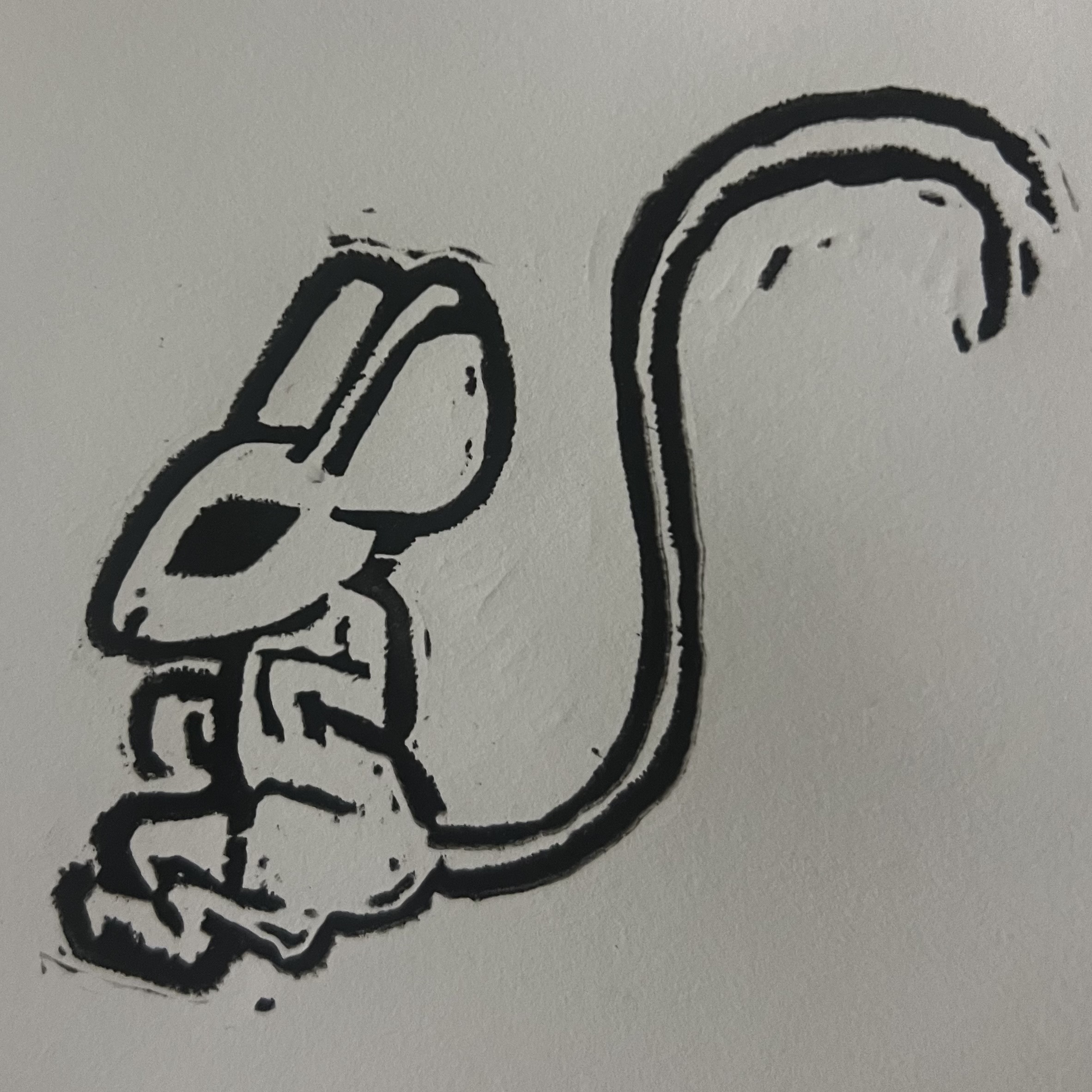 Black mouse printed on white paper