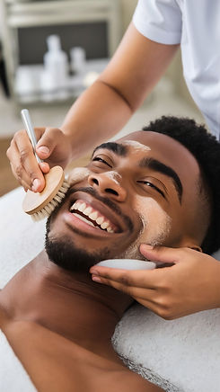 happy-young-man-getting-facial-exfoliation-scrub-with-brush-health-beauty-spa.jpg