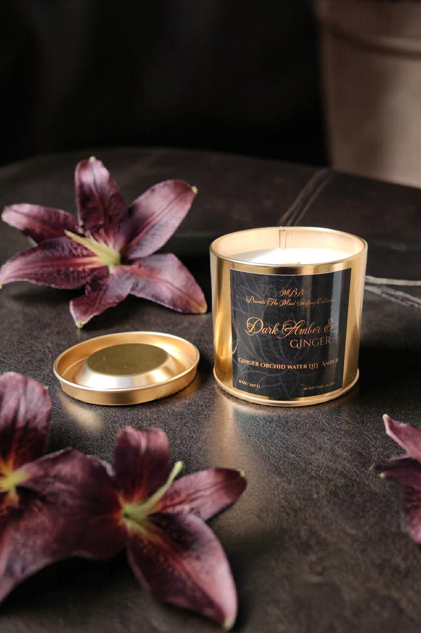 Dark Amber &amp; Ginger Lily candle in a crocodile textured tin.