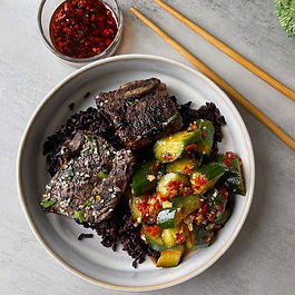 Tender grilled short ribs infused with garlic, ginger, and coconut aminos, served over rice with a spicy cucumber salad. A balanced, flavorful dish ideal for cozy nights or festive gatherings.