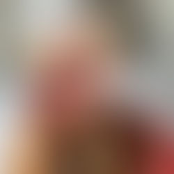 Cranberry Protein Pancakes stacked on a golden fork