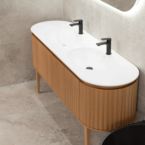 Stop-motion image series showing bathroom vanity with double sinks, open drawers, and LED-lit cabinetry, staged in a tiled interior.