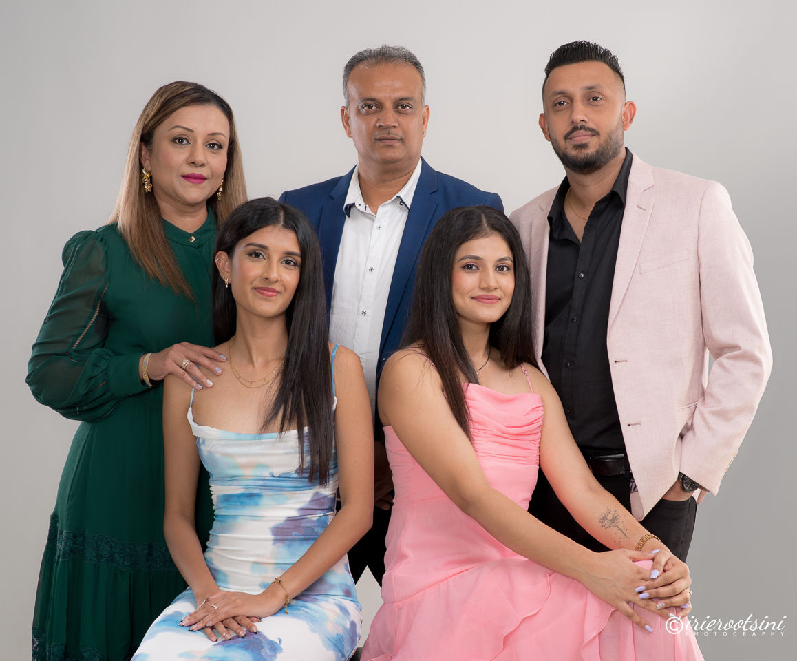 Five family members posing together during a Studio Portrait Session