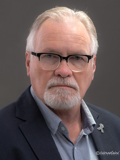 Senior male executive corporate headshot photographed in studio