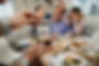 close-up-of-man-photographing-his-extended-family-2024-12-13-17-10-06-utc.jpg