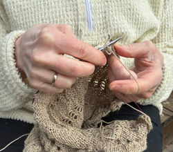 Icelandic woman knitting a wool sweater