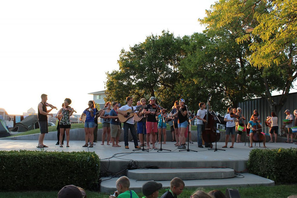 Fiddle camp group on stage outdoors