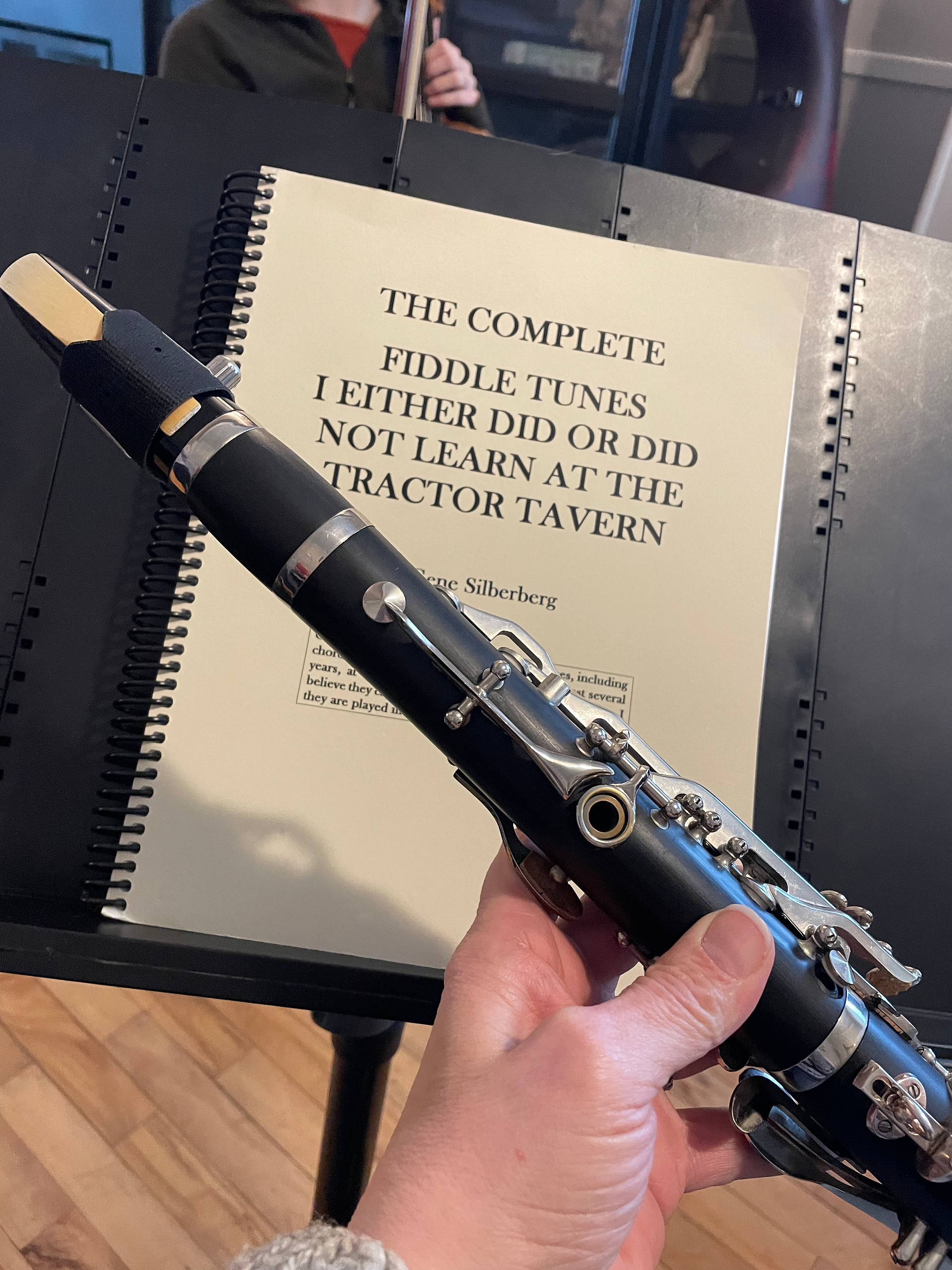 The tiny Eb clarinet in front of a stand with a fiddle tune book