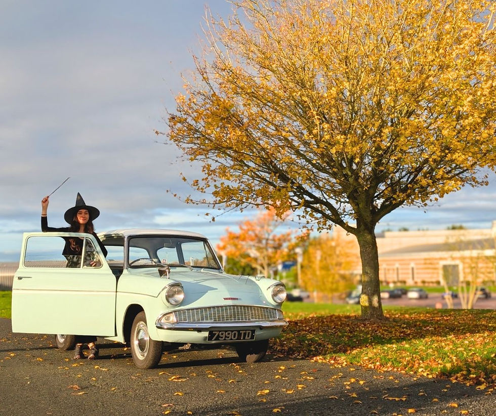 Museum Curator Cat Boxall with the Harry Potter Ford Anglia. Photo courtesy of the BMM.