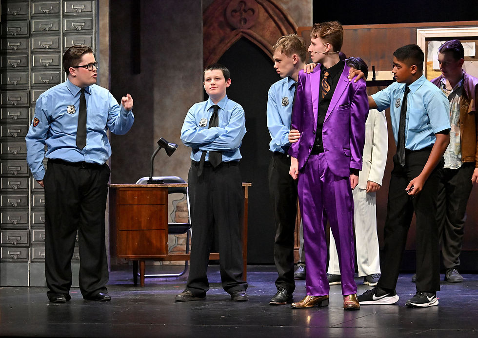 The cops catch up with Curtis. (Seth Baylis). Photo by Martin Pulley.